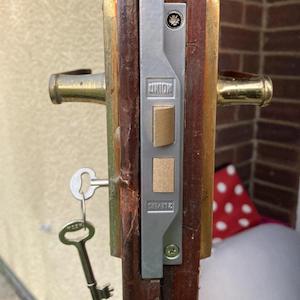 Lock installation on a front entrance door